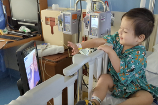 A toddler in a hospital bed