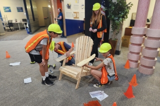 Children constructing a chair