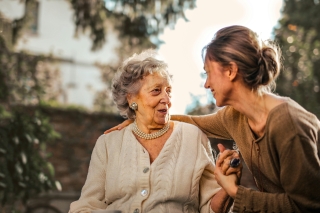 A volunteer with an elderly woman