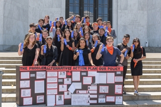 Group photo of kids in front of courthouse steps