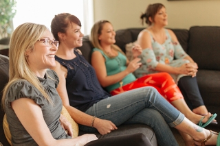 Four women have a discussion