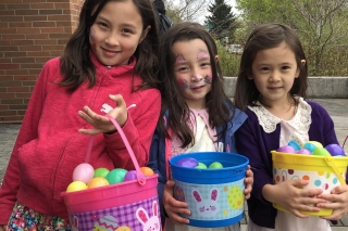 Photo of three girls at an egg hunt