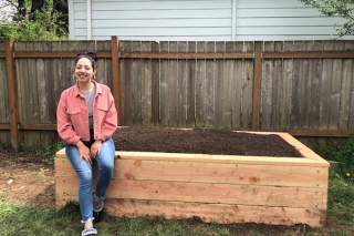 Photo of a woman and a planterbox