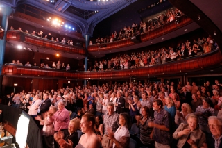 Photo of an audience inside a theater