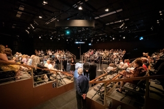 Photo of an audience inside a theater